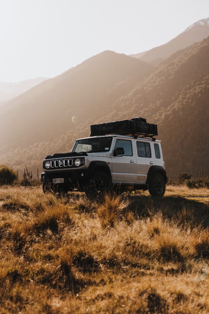 Suzuki Jimny adventure shot in South Island setting.