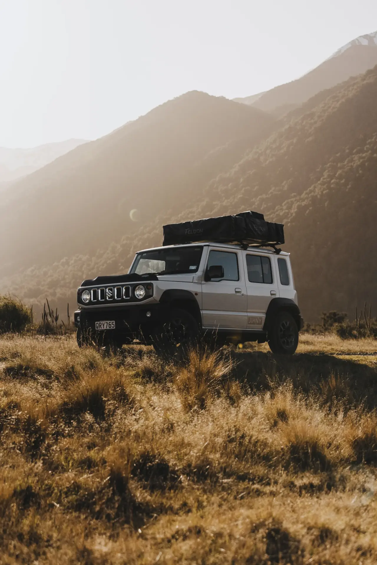 Suzuki Jimny adventure shot in South Island setting. – Jimny Rentals.
