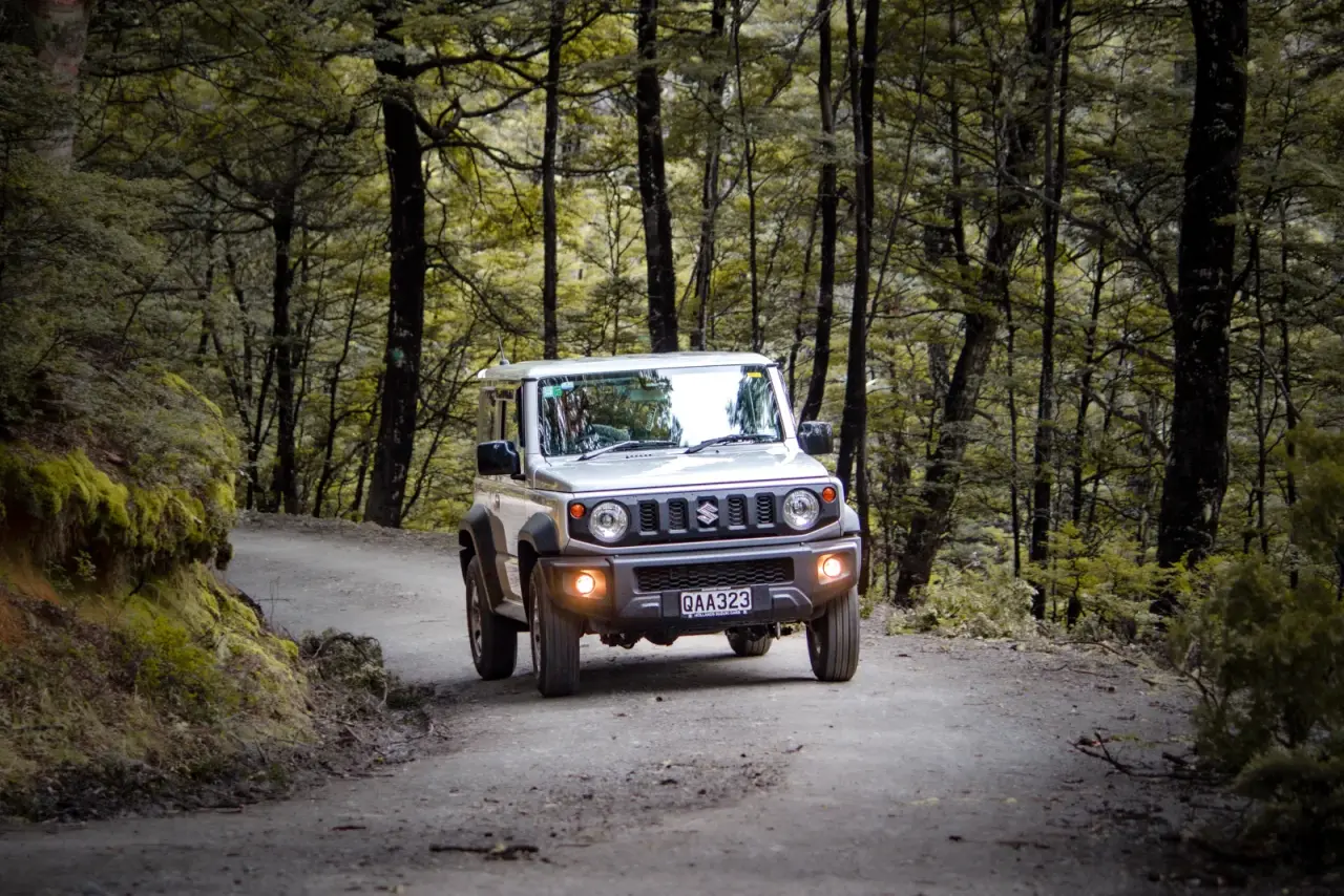Suzuki Jimny rental vehicle in New Zealand adventure setting. – Jimny Rentals.